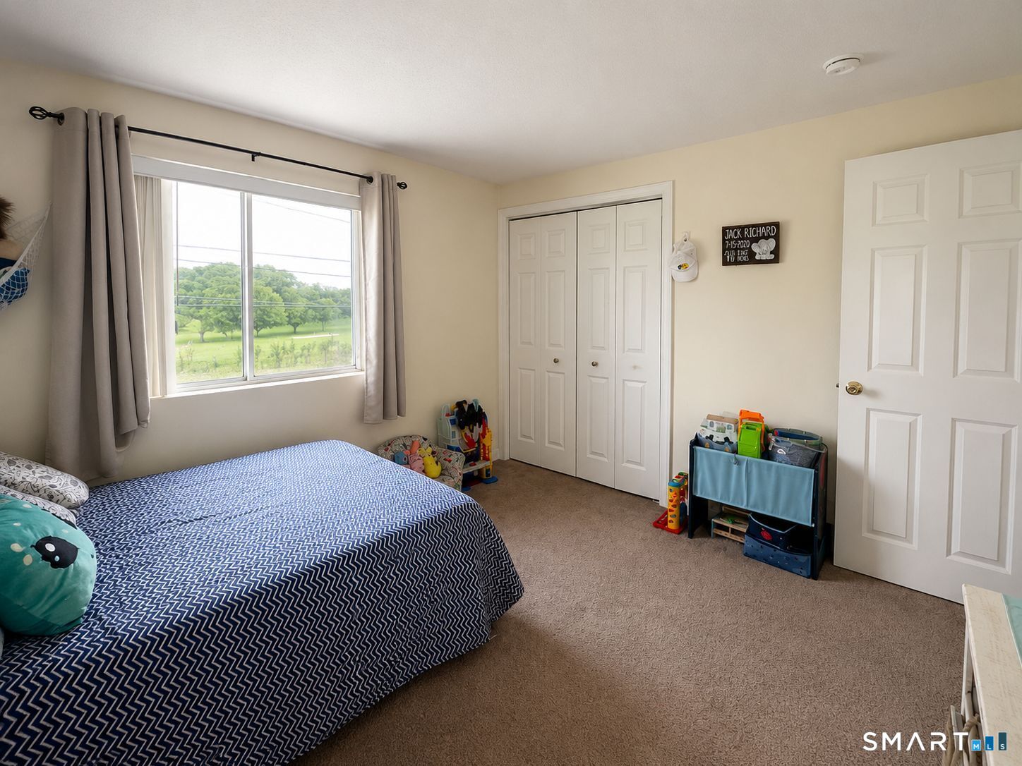 461 Spring Street, Unit 1A Naugatuck, CT 06770 - Photo 9 of 17 a bed room with a bed and a window