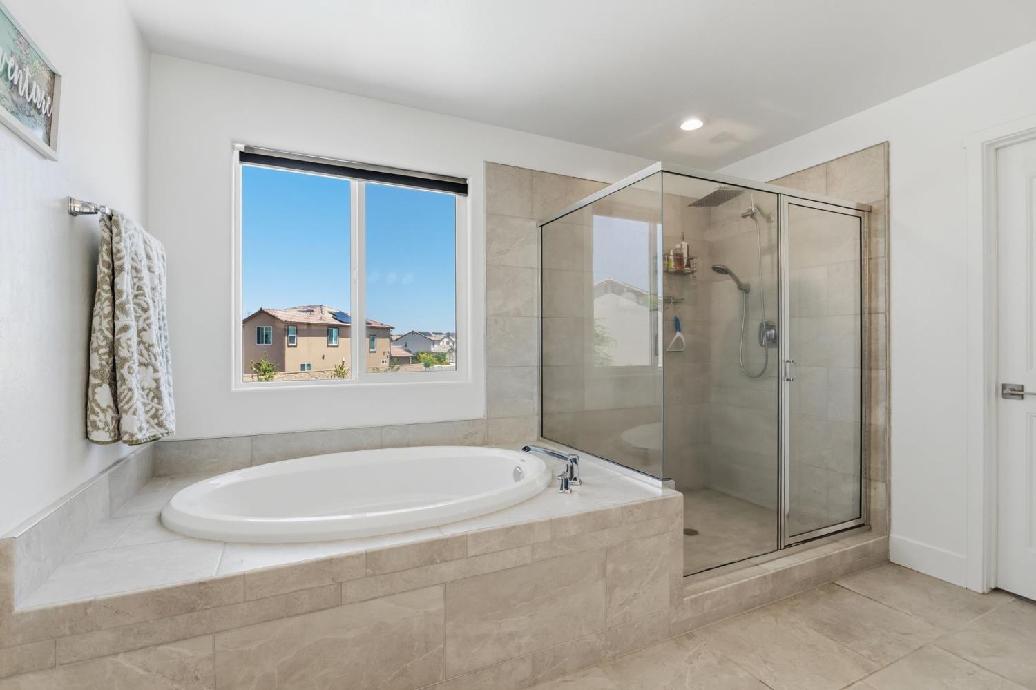 6326 West Richert Avenue Fresno, CA 93723 - Photo 27 of 45 a bathroom with a bathtub and a shower
