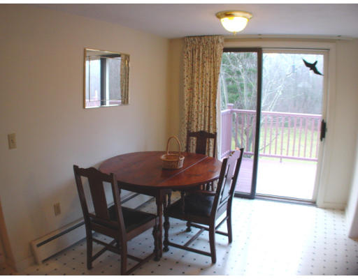 91 Birch Meadow Road Merrimac, MA 01860 - Photo 3 of 9 a view of a dining room with furniture and a window