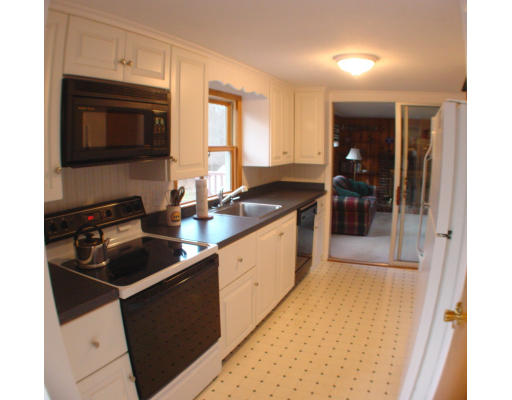 91 Birch Meadow Road Merrimac, MA 01860 - Photo 4 of 9 a kitchen with a sink stove and cabinets