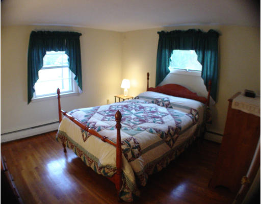91 Birch Meadow Road Merrimac, MA 01860 - Photo 6 of 9 a bedroom with a bed and window