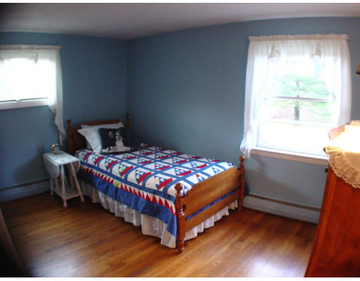 91 Birch Meadow Road Merrimac, MA 01860 - Photo 7 of 9 a bedroom with a bed and a window