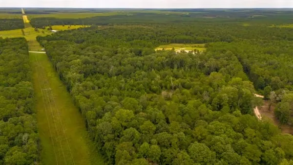 a view of a lake with a yard