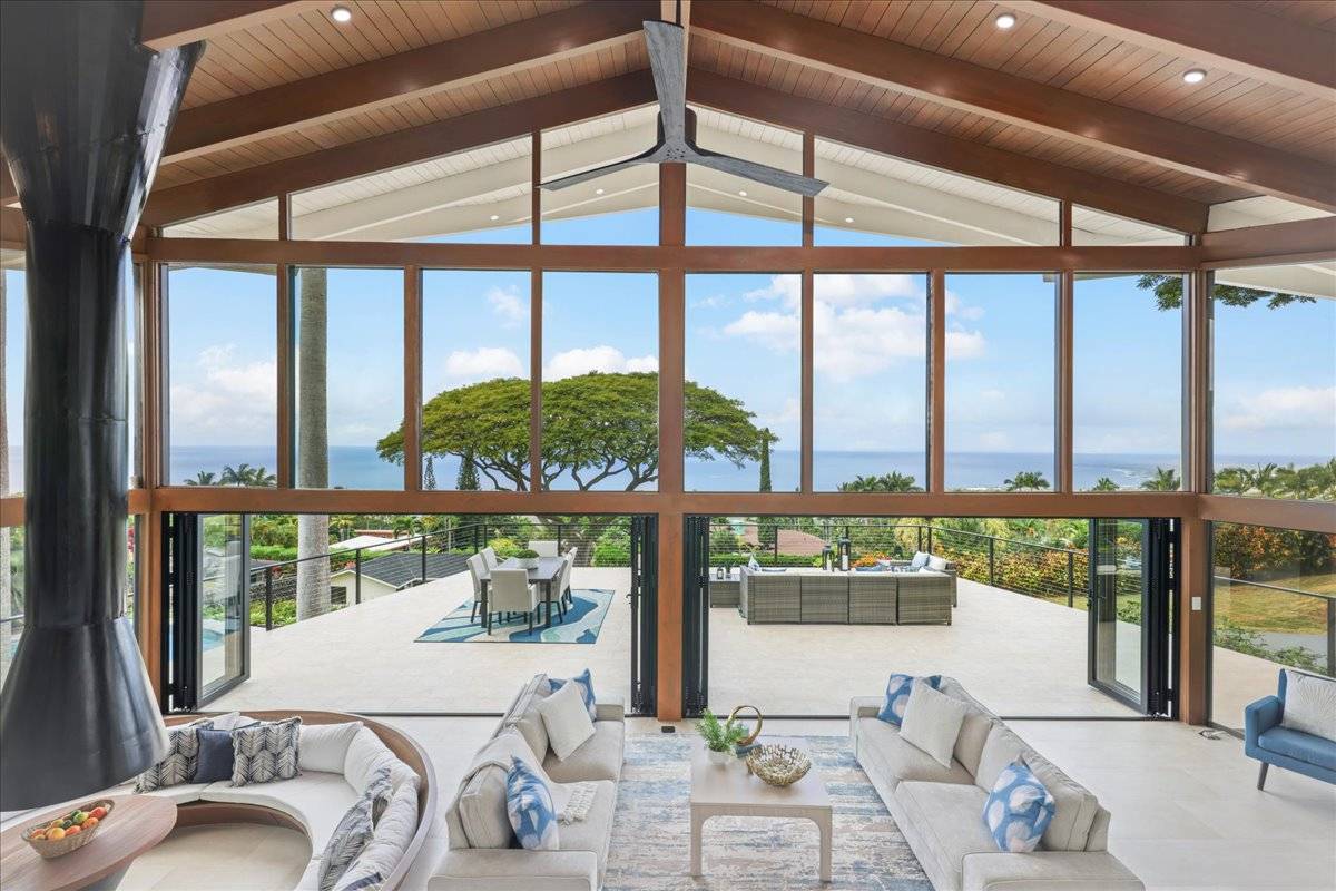 77-404 Pelenike Drive Kailua-Kona, HI 96740 - Photo 1 of 27 a view of a dining room with furniture window and outside view
