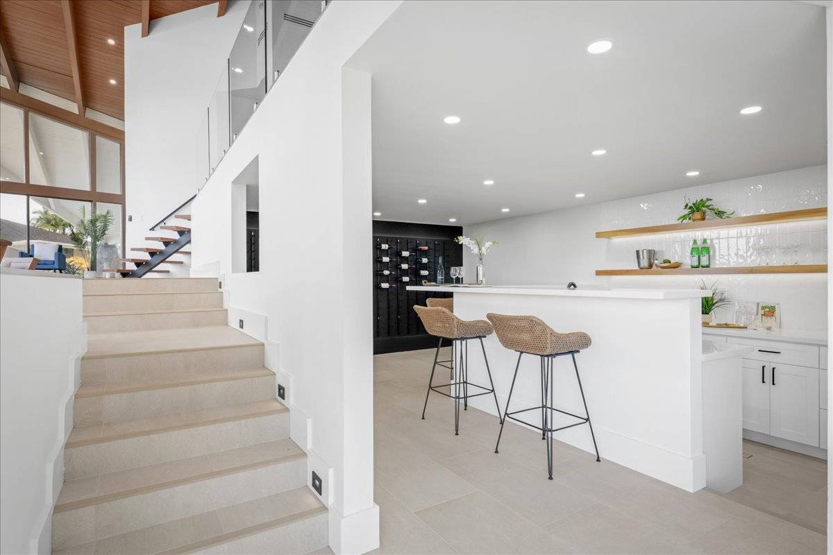77-404 Pelenike Drive Kailua-Kona, HI 96740 - Photo 12 of 27 a kitchen with stainless steel appliances kitchen island cabinets and a view of living room