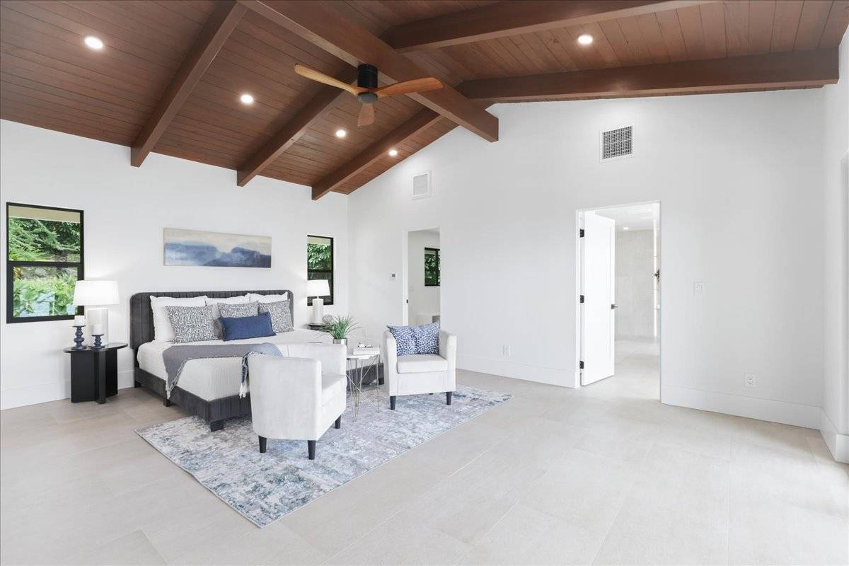 77-404 Pelenike Drive Kailua-Kona, HI 96740 - Photo 14 of 27 a living room with furniture and a large window