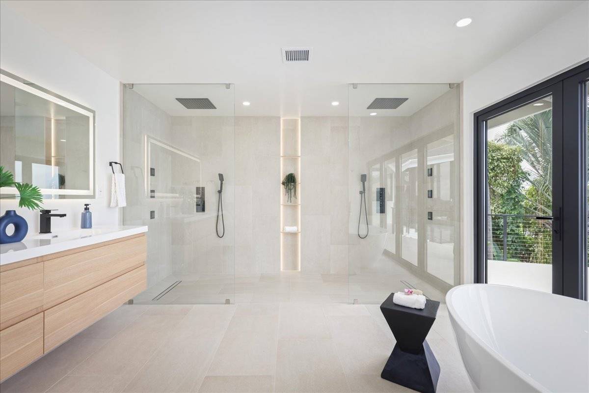 77-404 Pelenike Drive Kailua-Kona, HI 96740 - Photo 16 of 27 a bathroom with a granite countertop sink mirror bathtub and toilet