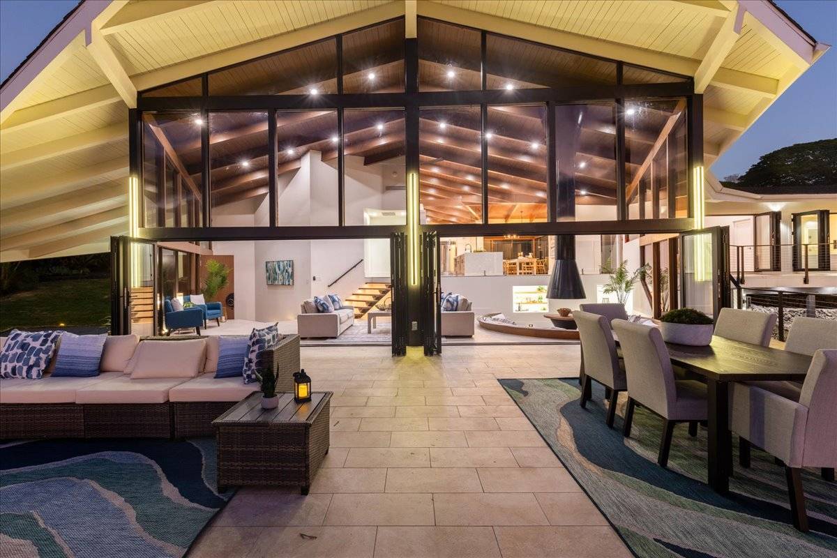 77-404 Pelenike Drive Kailua-Kona, HI 96740 - Photo 25 of 27 a living room with furniture and a chandelier