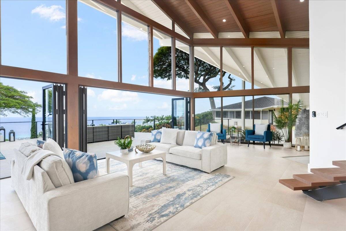 77-404 Pelenike Drive Kailua-Kona, HI 96740 - Photo 5 of 27 a living room with furniture and a large window