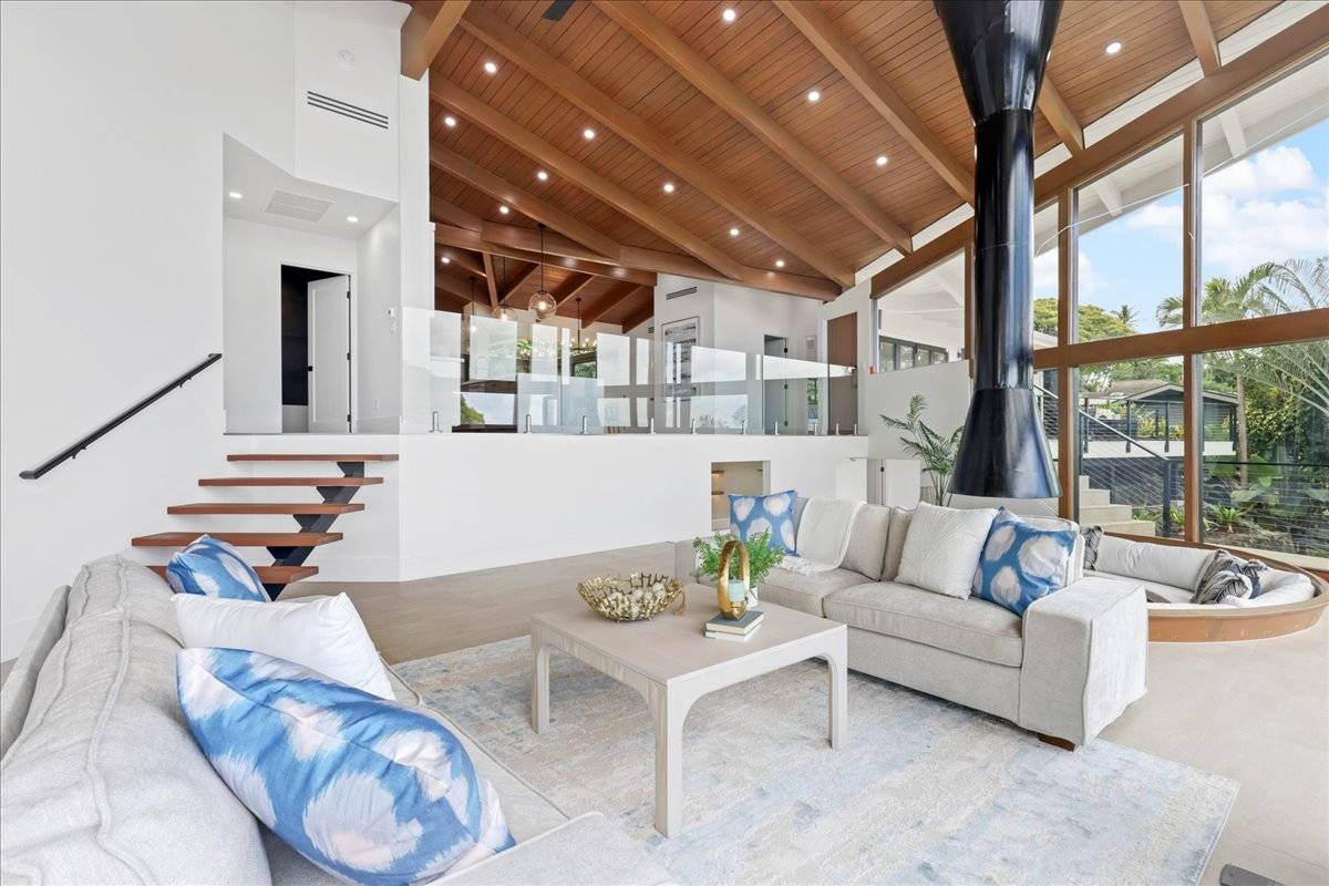 77-404 Pelenike Drive Kailua-Kona, HI 96740 - Photo 7 of 27 a living room with furniture and a large window