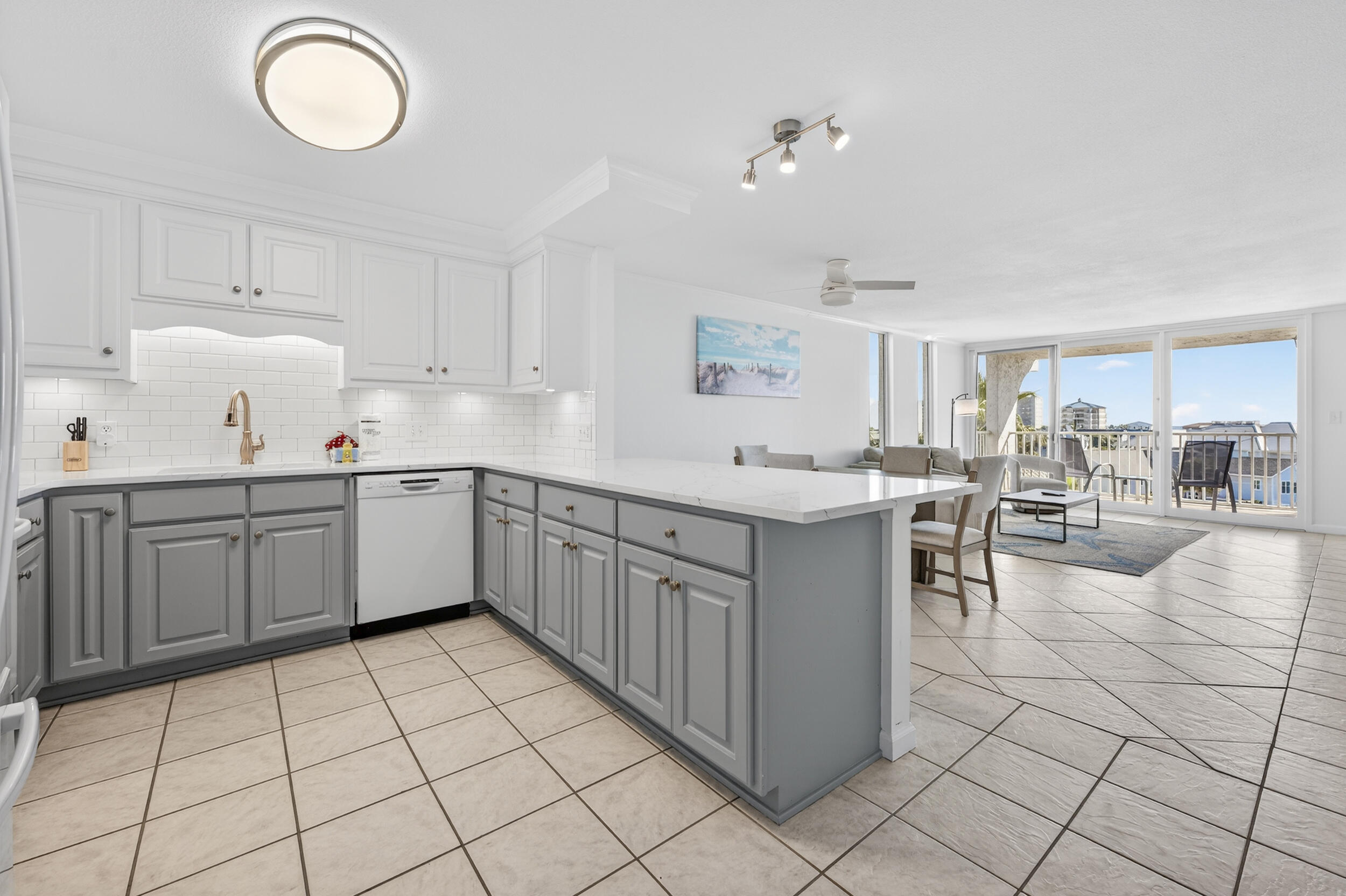 30 Moreno Point Road, Unit 502A Destin, FL 32541 - Photo 11 of 71 a kitchen with a sink cabinets and window