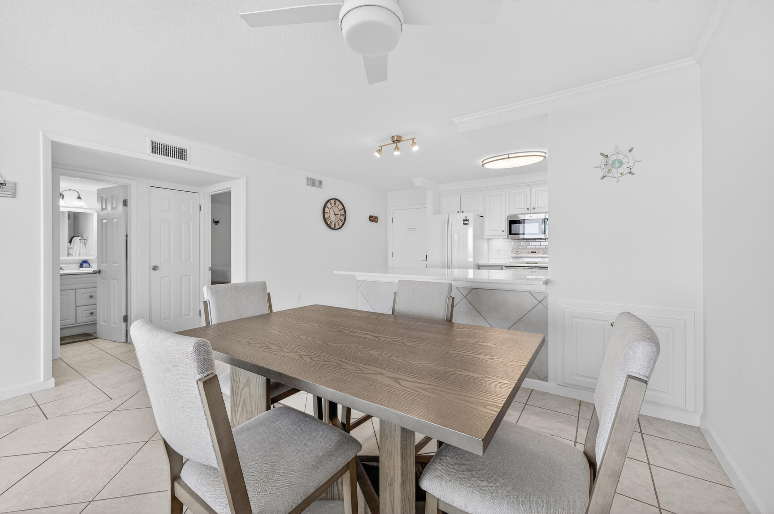 30 Moreno Point Road, Unit 502A Destin, FL 32541 - Photo 15 of 71 a view of a dining room with furniture and wooden floor