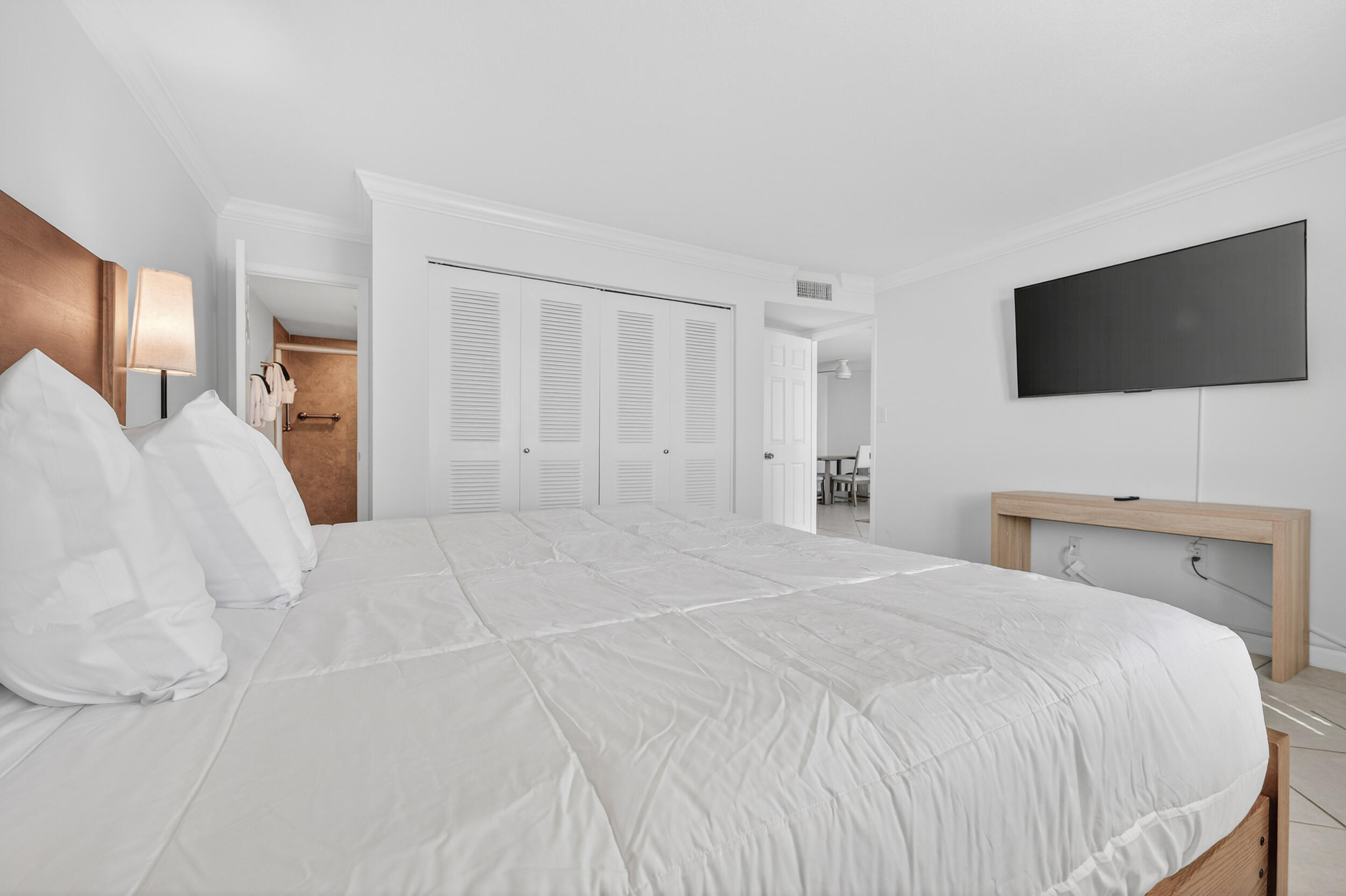 30 Moreno Point Road, Unit 502A Destin, FL 32541 - Photo 27 of 71 a bedroom with a bed and a flat screen tv