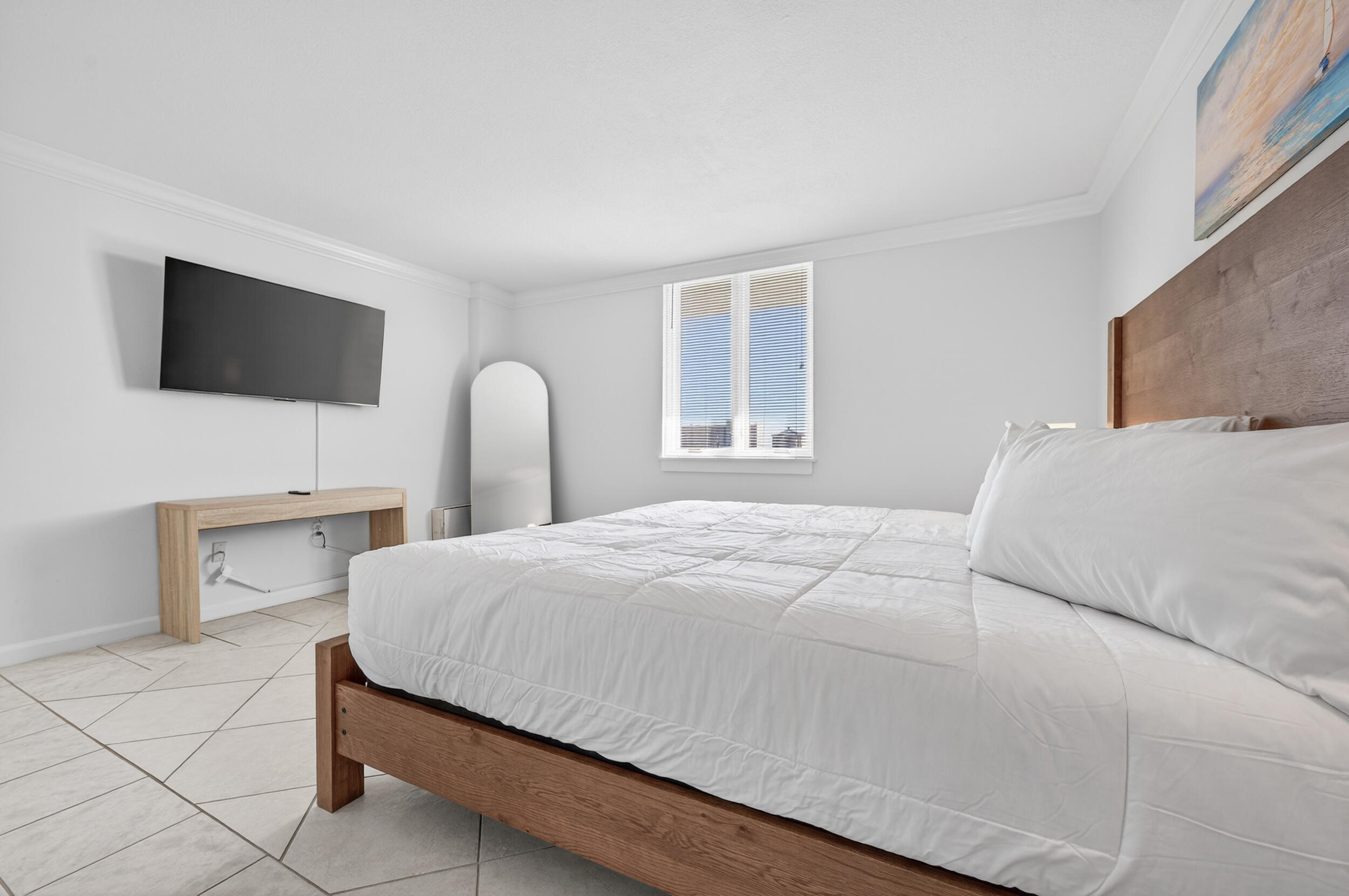 30 Moreno Point Road, Unit 502A Destin, FL 32541 - Photo 28 of 71 a bedroom with a bed and a flat screen tv