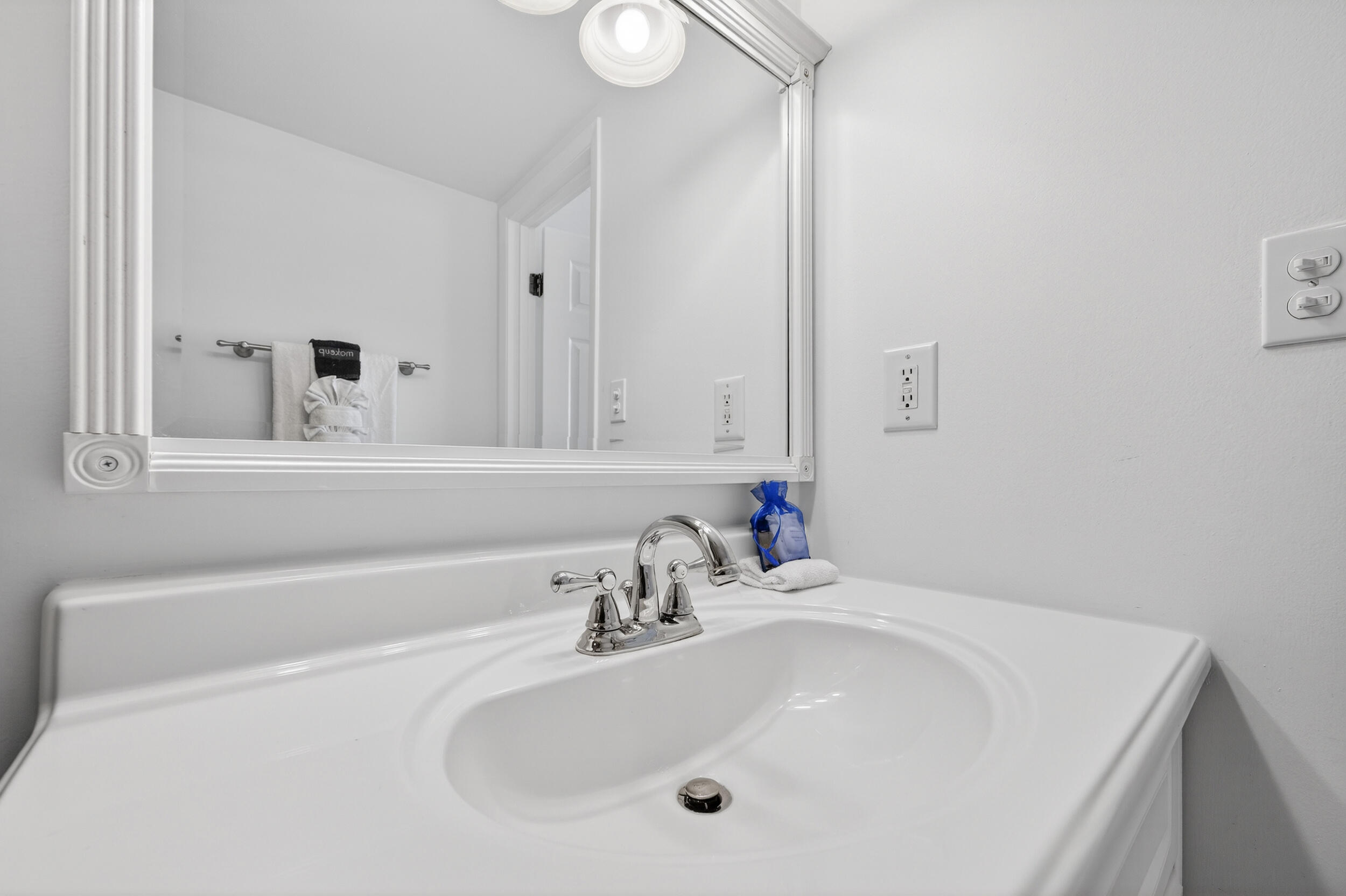 30 Moreno Point Road, Unit 502A Destin, FL 32541 - Photo 33 of 71 a bathroom with a sink and a mirror