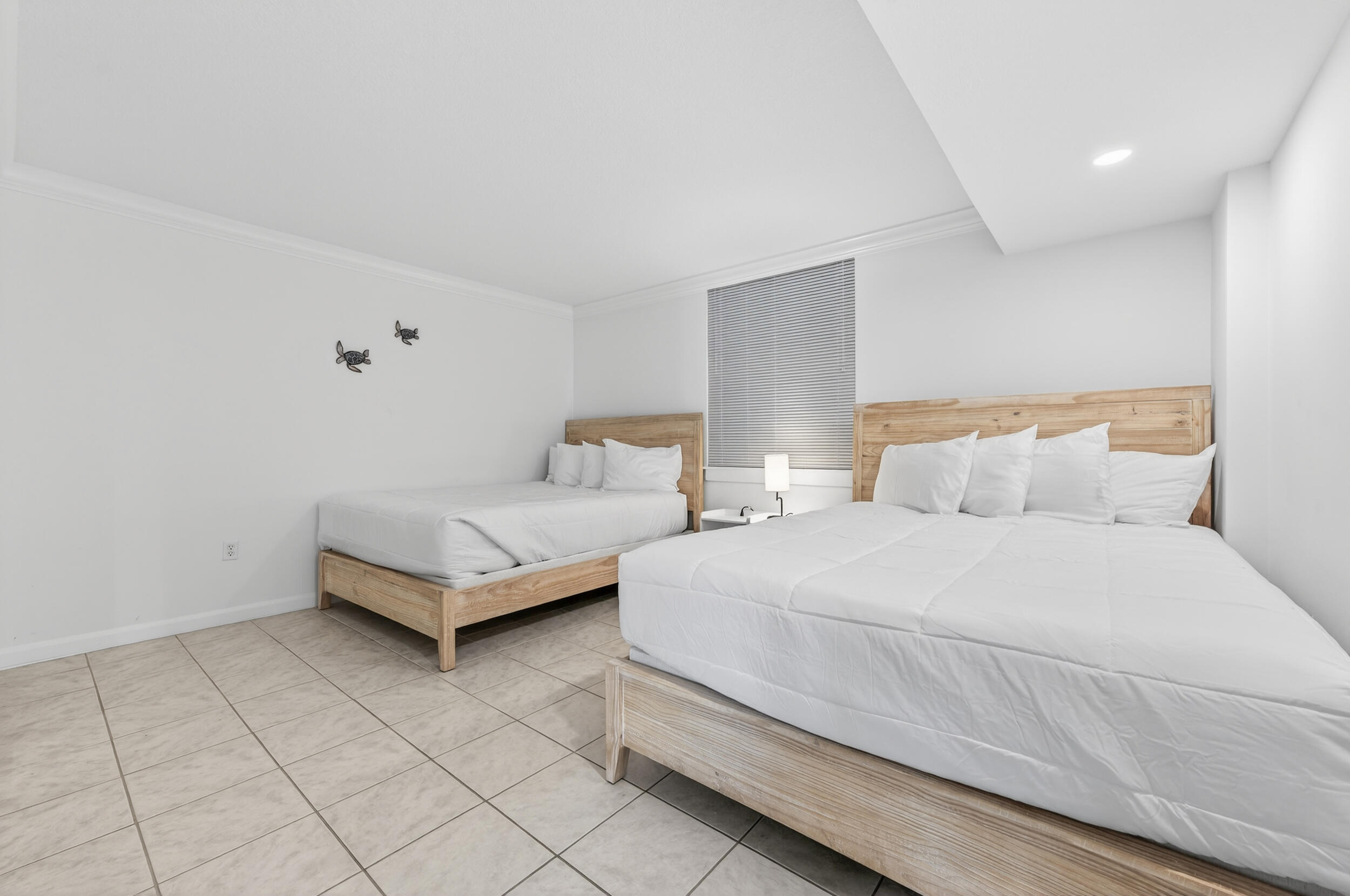 30 Moreno Point Road, Unit 502A Destin, FL 32541 - Photo 39 of 71 a bedroom with a bed and a night stand