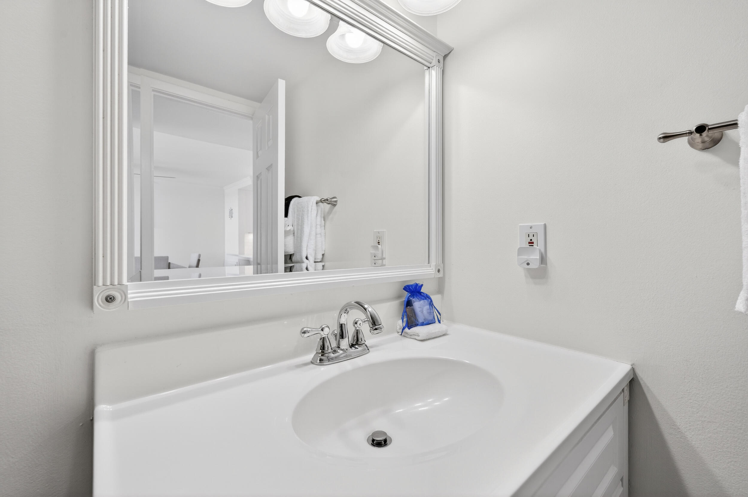 30 Moreno Point Road, Unit 502A Destin, FL 32541 - Photo 45 of 71 a bathroom with a sink and a mirror