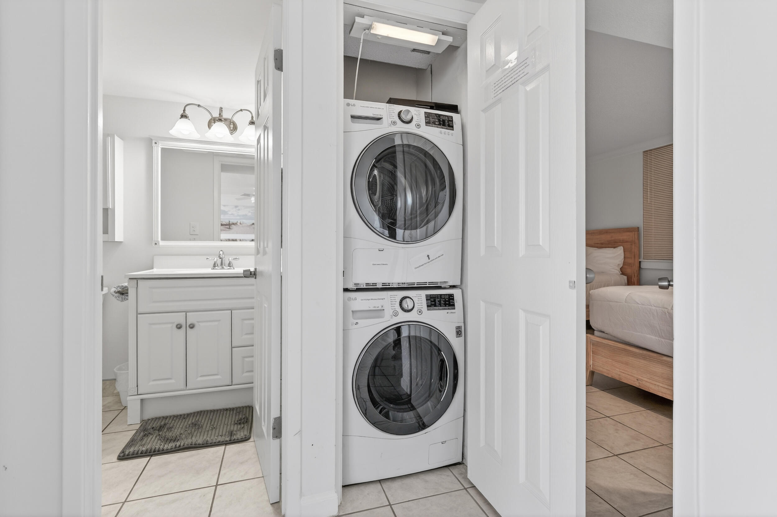 30 Moreno Point Road, Unit 502A Destin, FL 32541 - Photo 46 of 71 a view of a hallway with washer and dryer