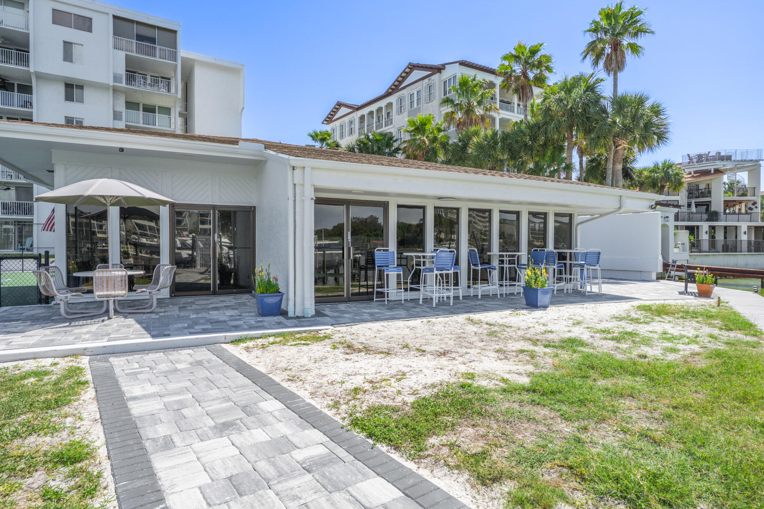 30 Moreno Point Road, Unit 502A Destin, FL 32541 - Photo 68 of 71 a view of a house with backyard porch and sitting area