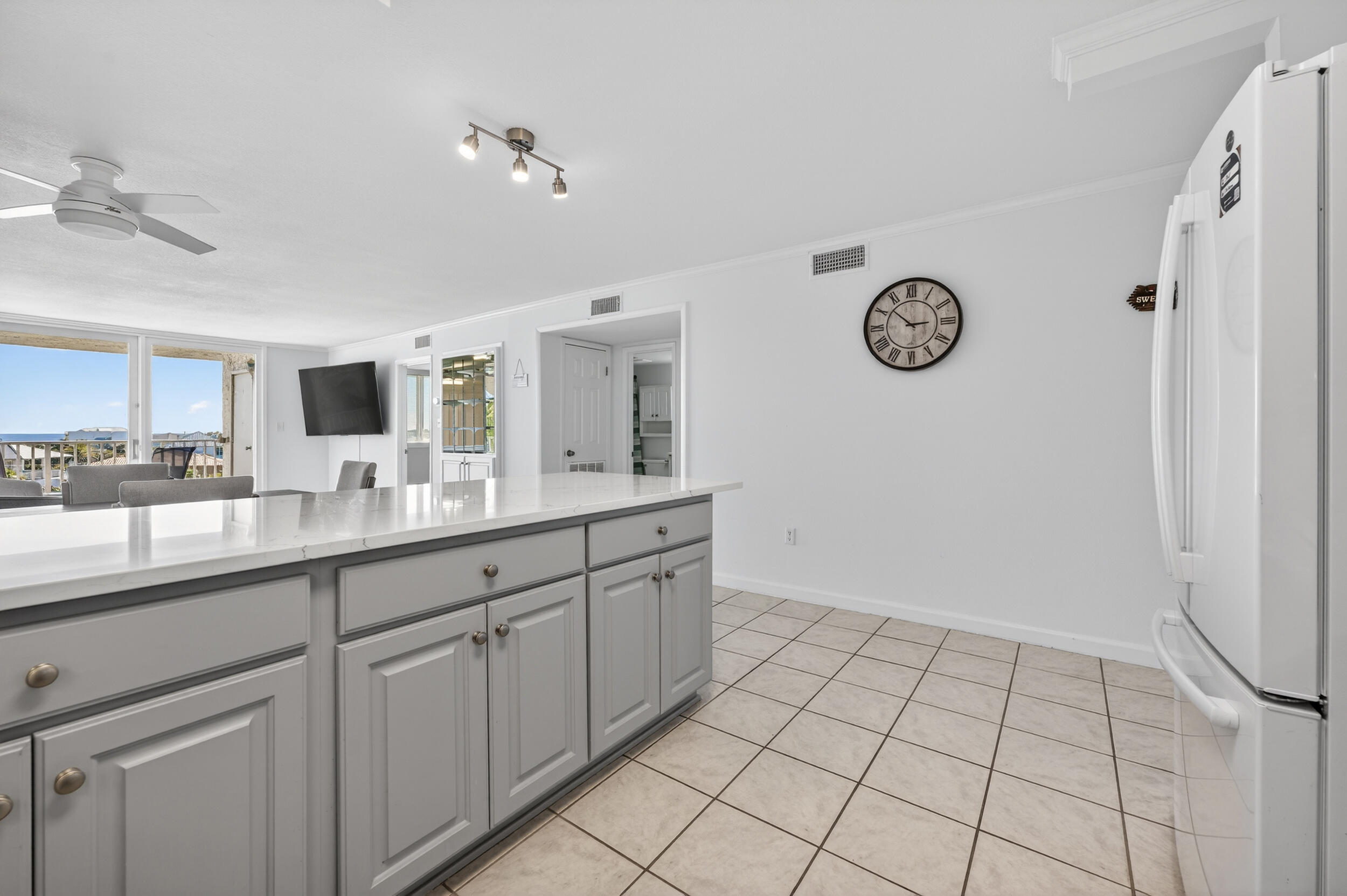 30 Moreno Point Road, Unit 502A Destin, FL 32541 - Photo 7 of 71 a spacious bathroom with a double vanity sink and a mirror