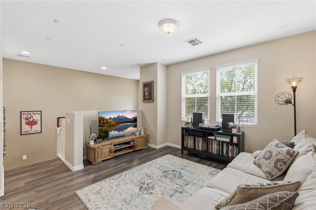 4650 Ranch House Road, Unit 126 North Las Vegas, NV 89031 - Photo 7 of 44 This inviting family room (13'x12') features durable wood-style flooring, perfect for comfortable daily living.