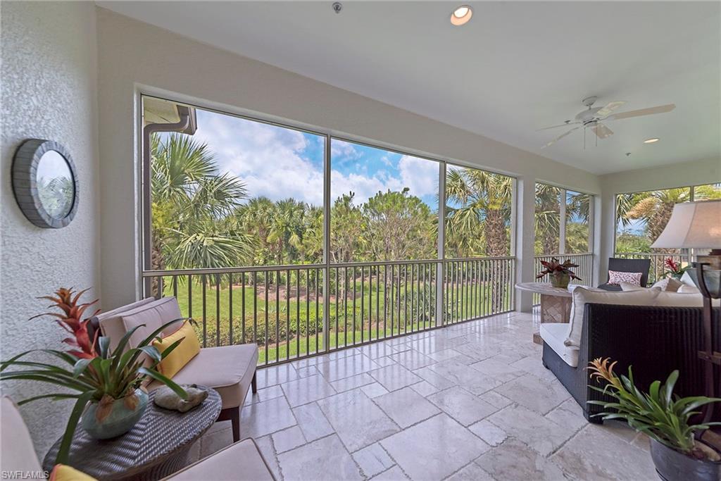 12014 Covent Garden Court, Unit 202 Naples, FL 34120 - Photo 19 of 50 Sunroom with a textured wall, stone tile flooring, and recessed lighting