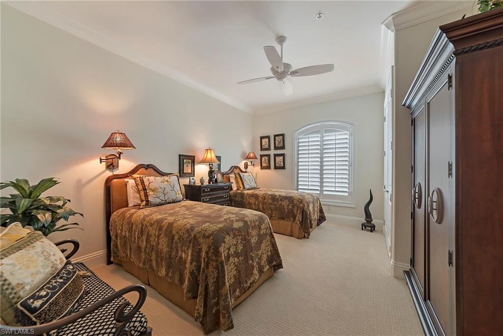 12014 Covent Garden Court, Unit 202 Naples, FL 34120 - Photo 29 of 50 Bedroom with ornamental molding, light carpet, and ceiling fan