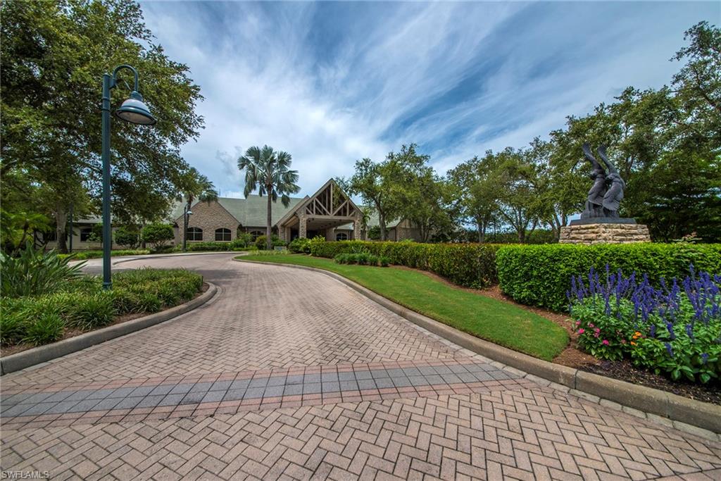 12014 Covent Garden Court, Unit 202 Naples, FL 34120 - Photo 36 of 50 Surrounding community with decorative driveway