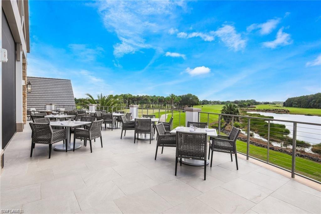 12014 Covent Garden Court, Unit 202 Naples, FL 34120 - Photo 37 of 50 View of patio featuring outdoor dining area, a water view, and golf course view