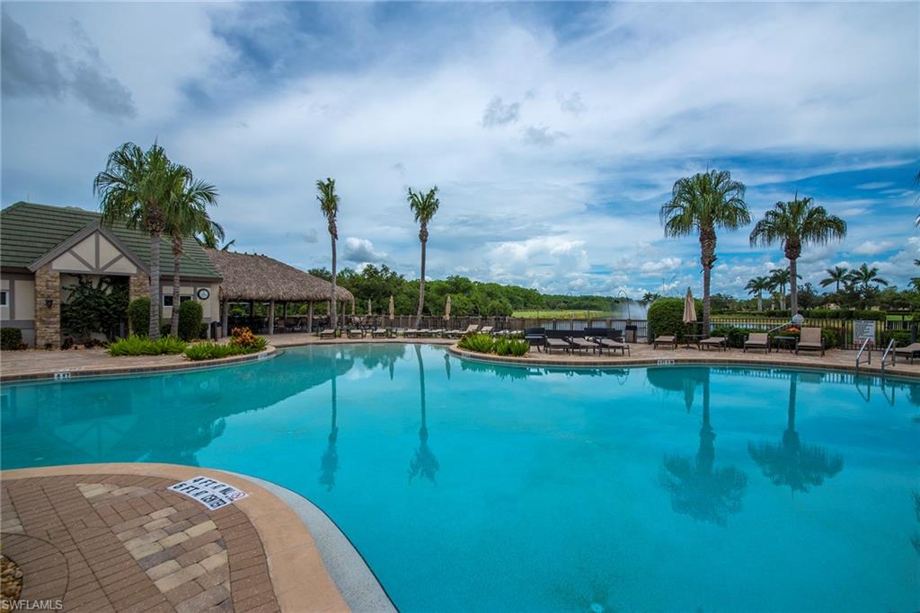 12014 Covent Garden Court, Unit 202 Naples, FL 34120 - Photo 43 of 50 Community pool featuring a patio area