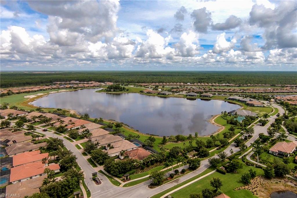 12014 Covent Garden Court, Unit 202 Naples, FL 34120 - Photo 45 of 50 Aerial overview of property's location with a nearby body of water and nearby suburban area