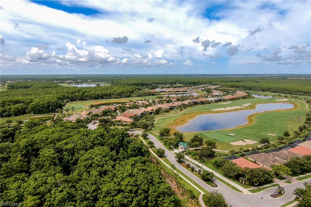 12014 Covent Garden Court, Unit 202 Naples, FL 34120 - Photo 47 of 50 Aerial perspective of suburban area with a large body of water and a golf club