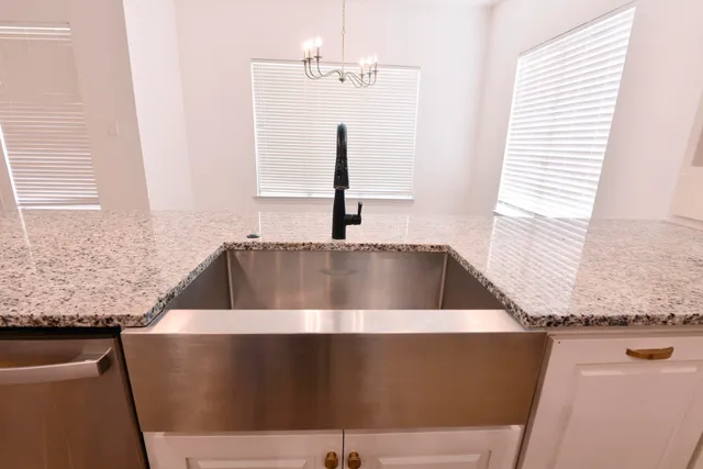 a view of kitchen sink and window