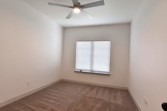 a kitchen with granite countertop a sink and cabinets