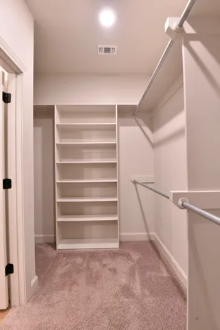 a view of an empty walk in closet