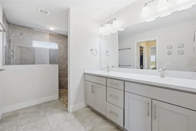 a dining room with furniture and a floor to ceiling window