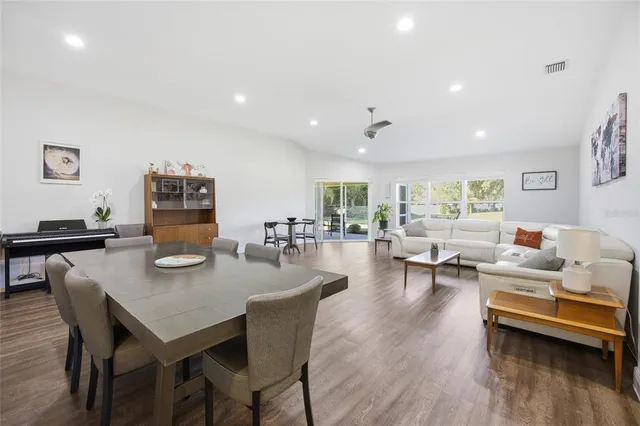 a kitchen with stainless steel appliances a sink stove and refrigerator