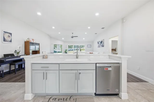 a kitchen with stainless steel appliances granite countertop a sink and cabinets