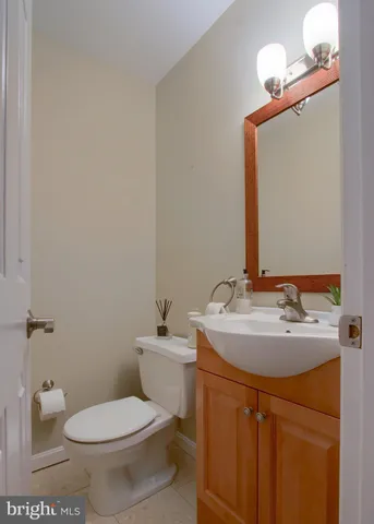 a bedroom with a bed window and dresser