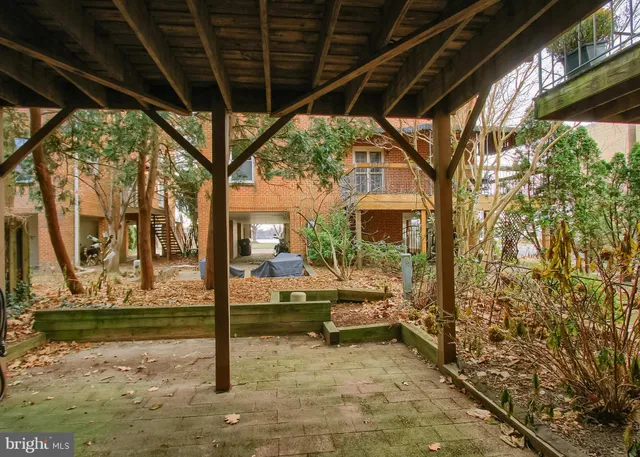 a view of porch with a bench