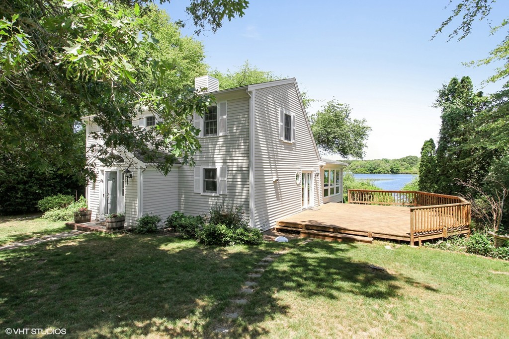 300 Huckins Neck Road Barnstable, MA 02601 - Photo 1 of 10 a view of backyard of house with green space