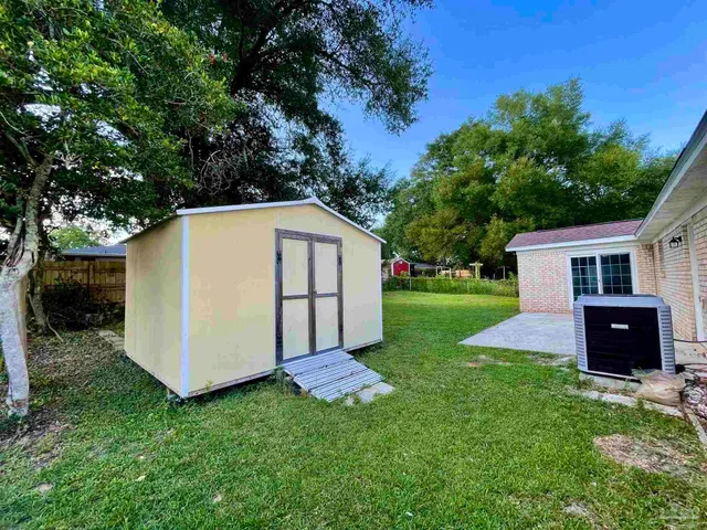 a view of a back yard of the house