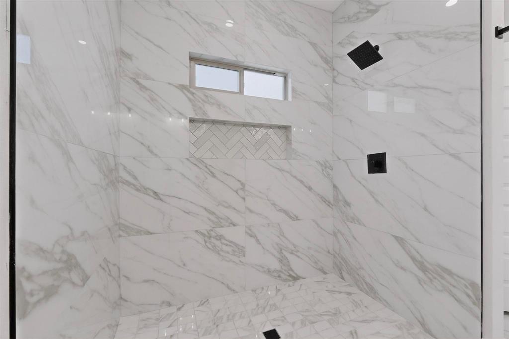 10110 Budtime Lane Dallas, TX 75217 - Photo 26 of 34 a bathroom with a shower