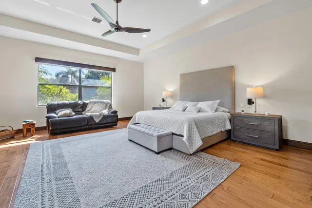 a bathroom with a double vanity sink mirror and bathtub