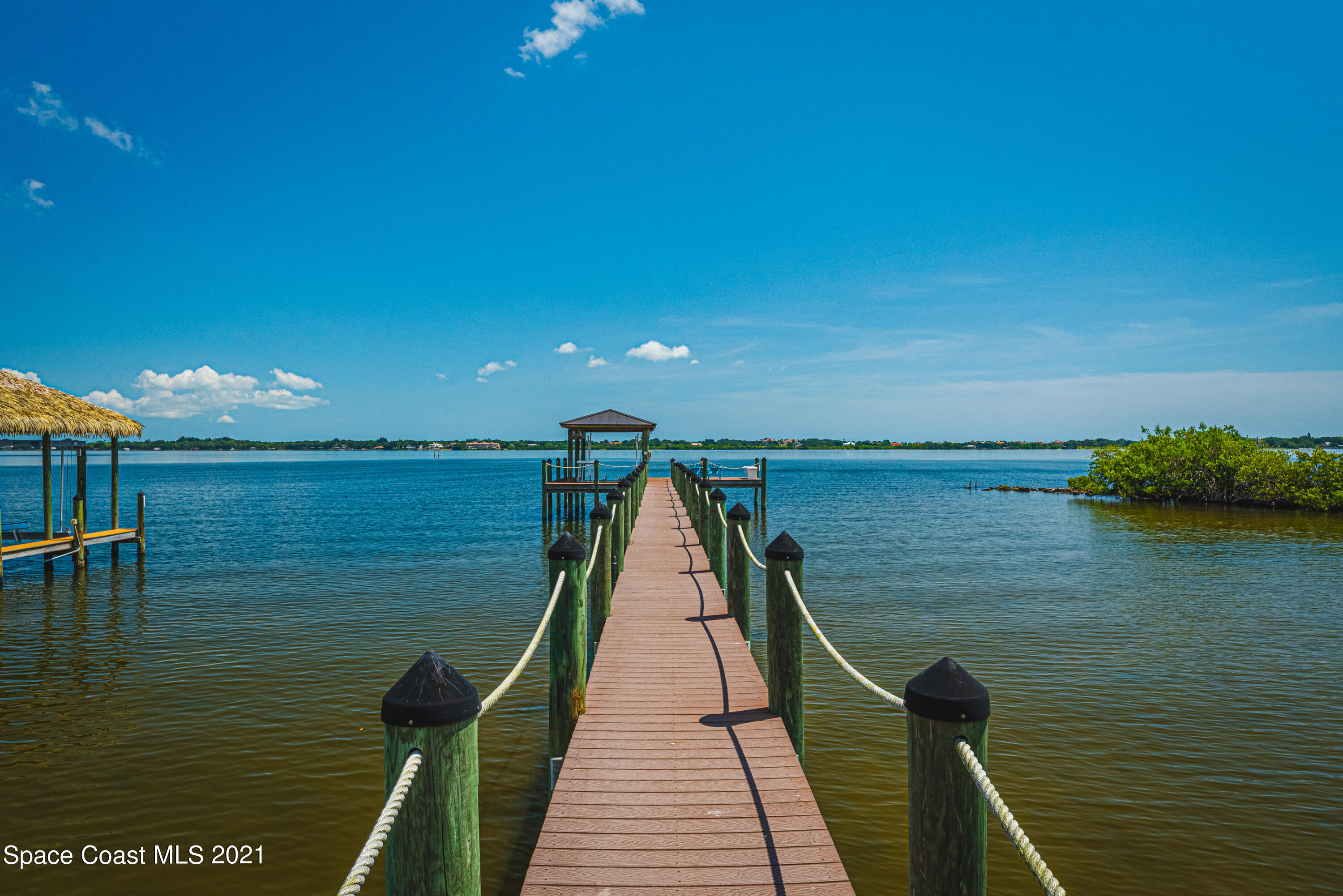 5419 Robles Lane Rockledge, FL 32955 - Photo 3 of 61 a view of a lake with a floor to ceiling window