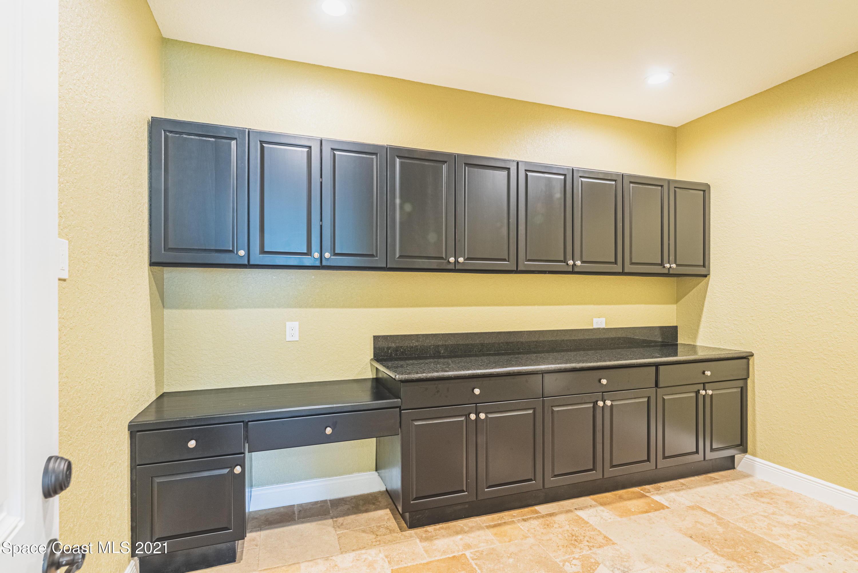 5419 Robles Lane Rockledge, FL 32955 - Photo 41 of 61 a view of a kitchen with cabinets