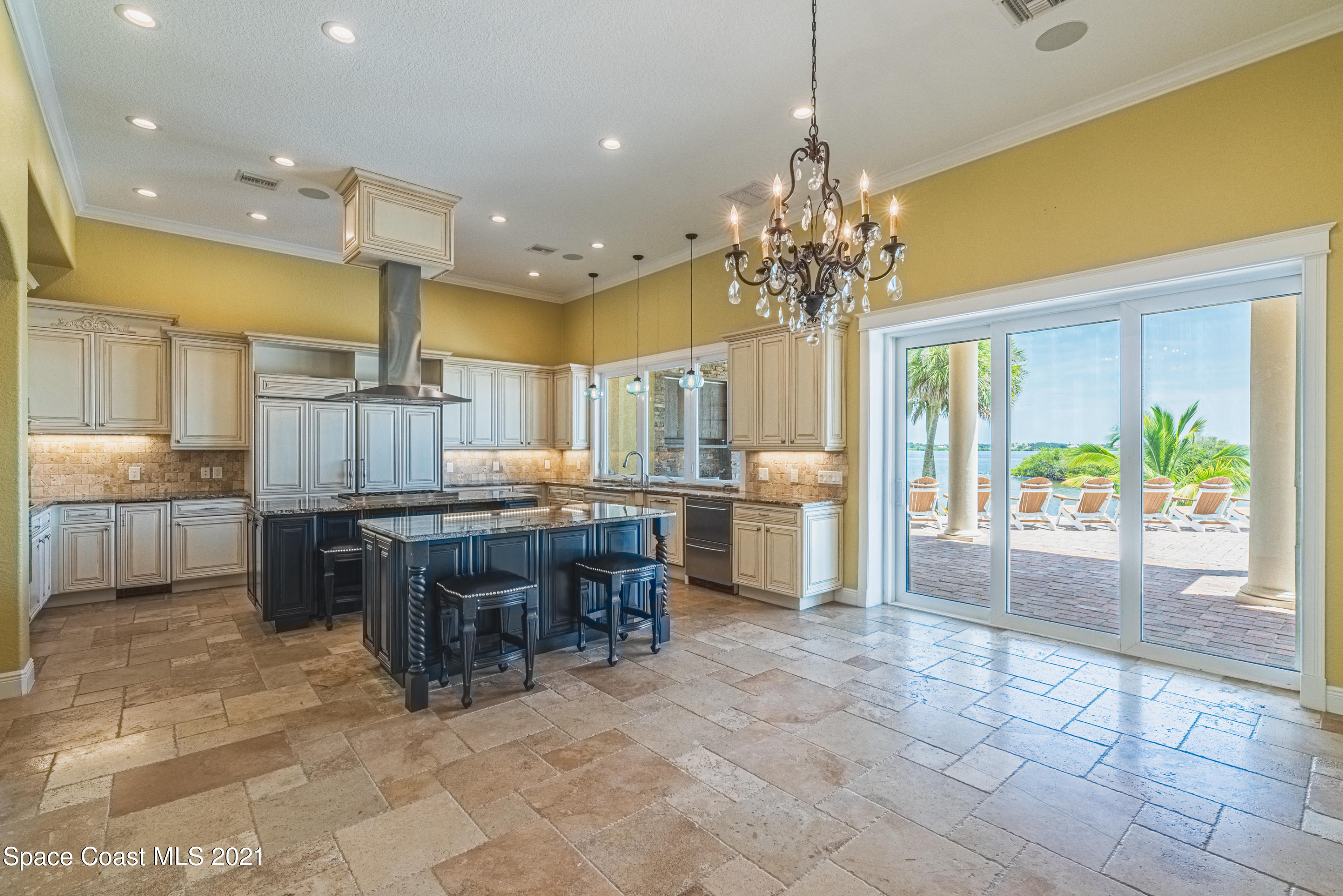 5419 Robles Lane Rockledge, FL 32955 - Photo 42 of 61 a room with kitchen island granite countertop furniture and a fireplace