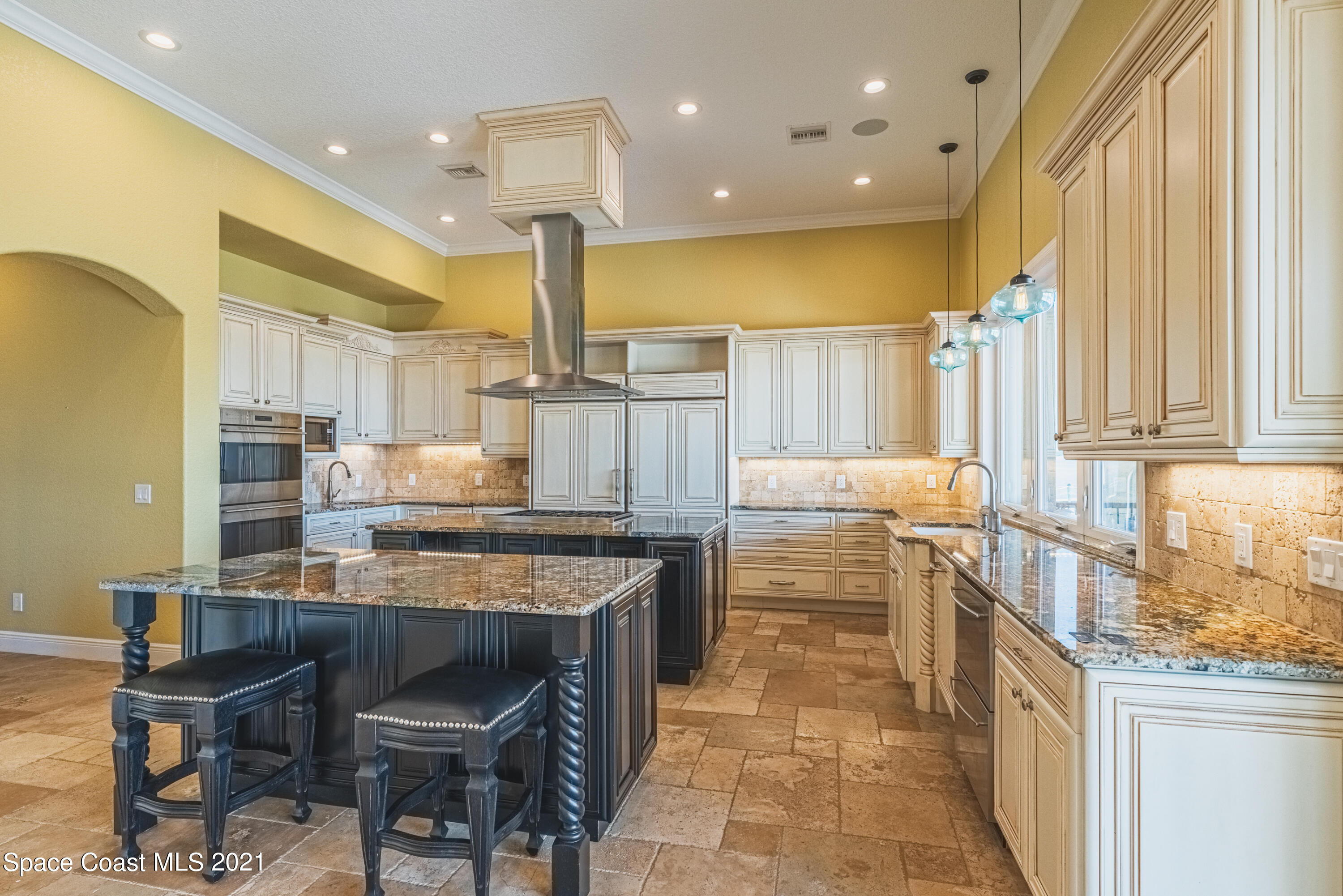 5419 Robles Lane Rockledge, FL 32955 - Photo 10 of 61 a kitchen with a table chairs sink and cabinets