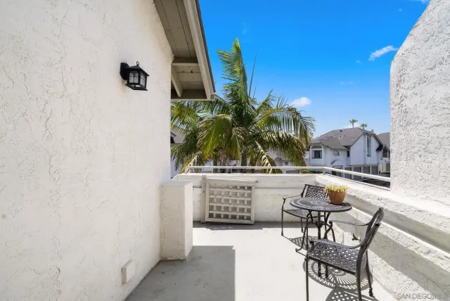 a swimming pool with outdoor seating and yard