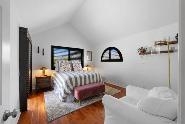 a bedroom with a bed and window